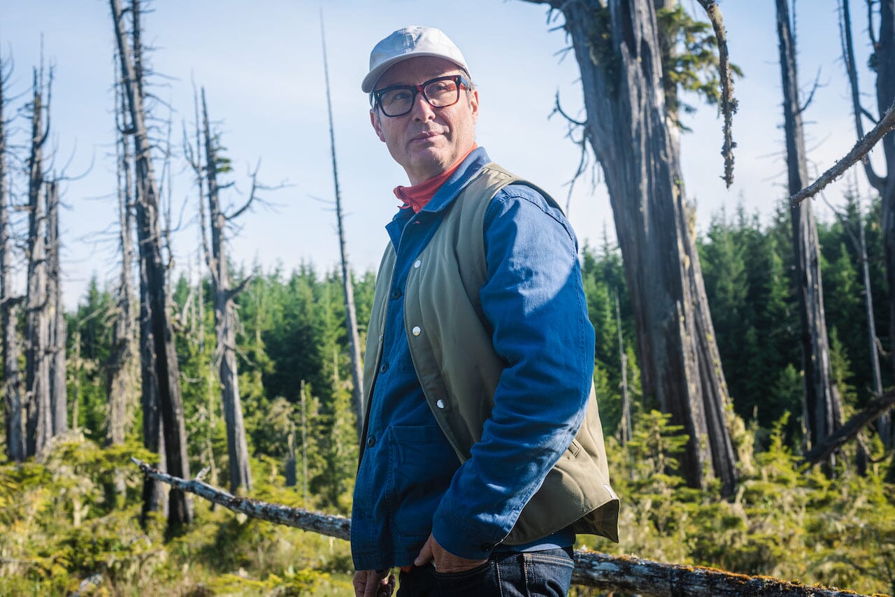 Paul Walde stands in an old growth forest