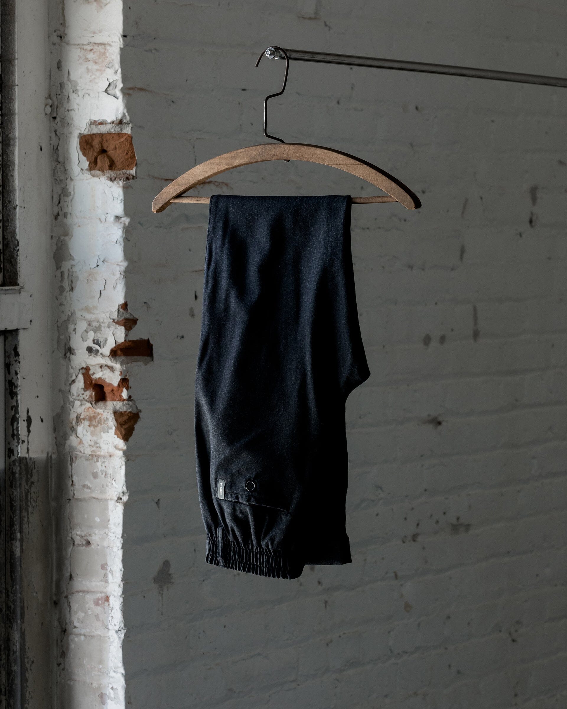 The Mens Light Wool Pants in Heather Charcoal - Folded #color_heather charcoal