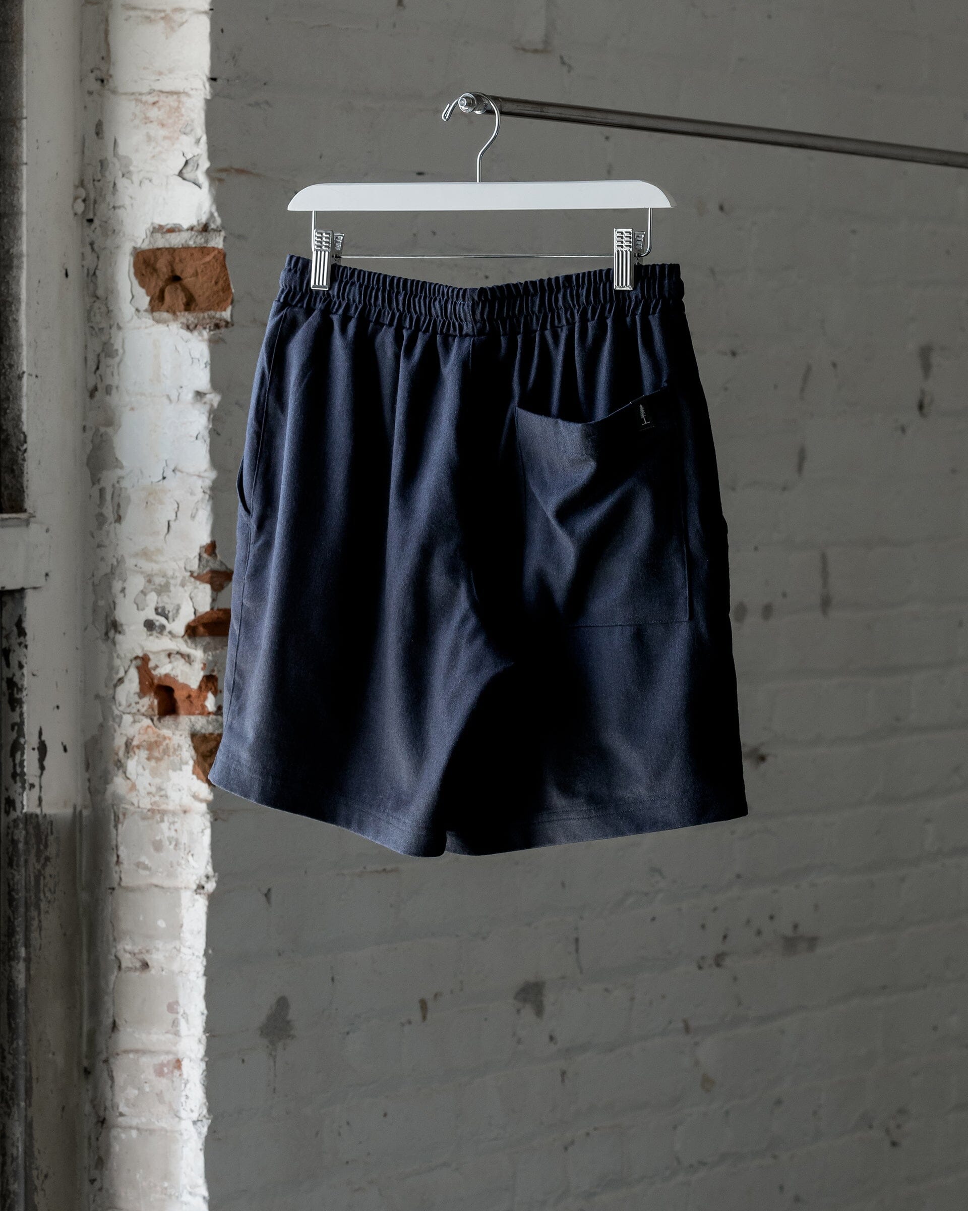 The Mens Light Wool Short in Heather Navy - Back #color_heather-navy