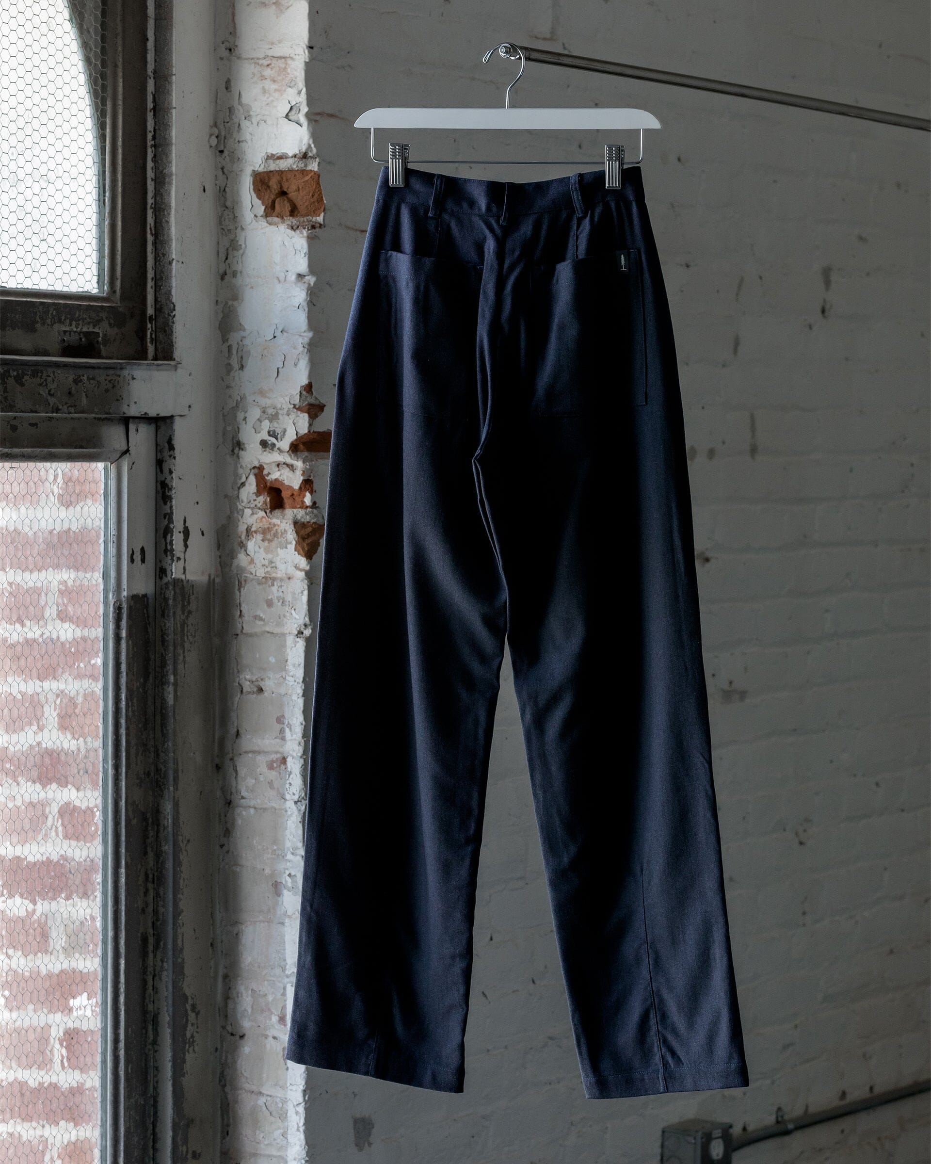 The Womens Light Wool Pant in Heather Navy - Back #color_heather navy