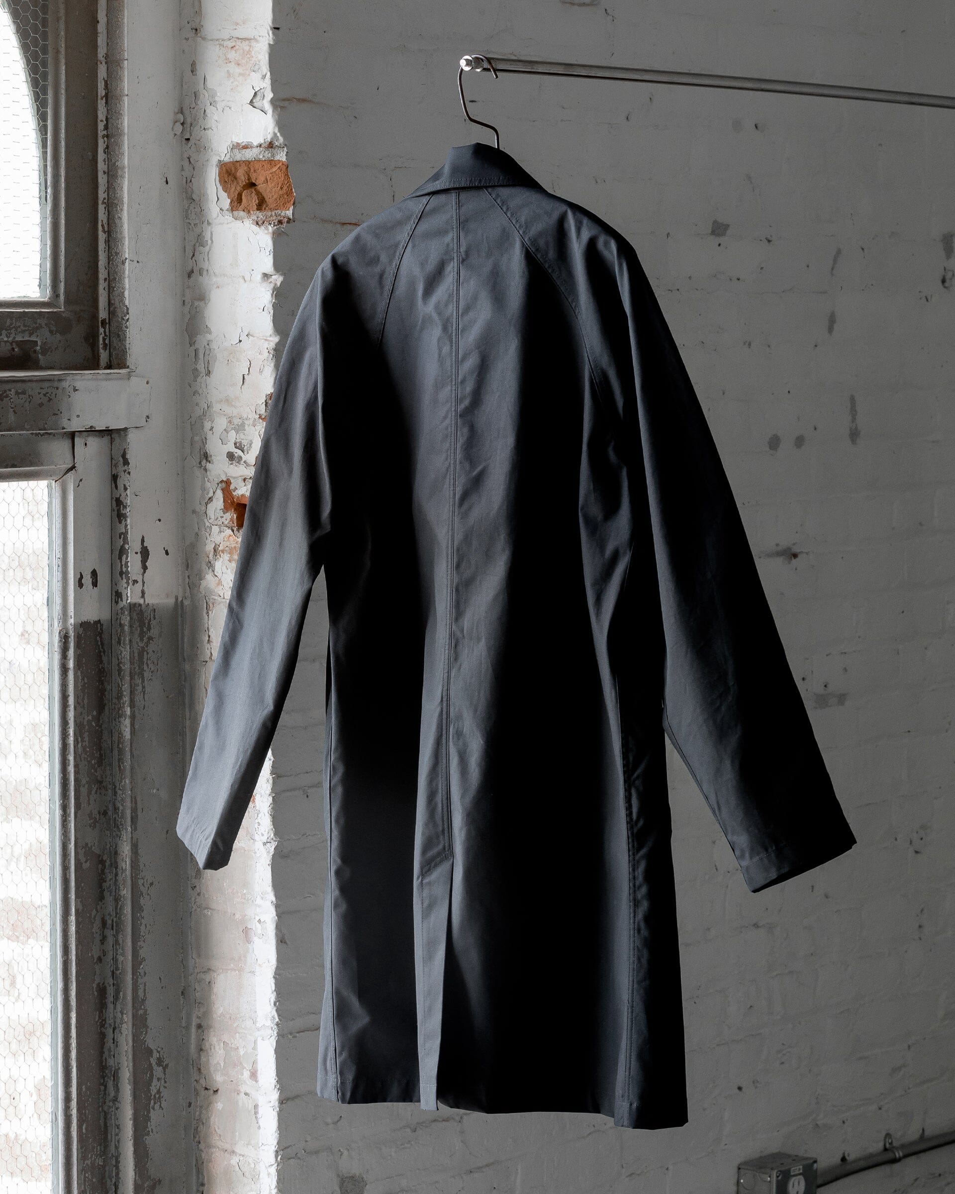 The Ventile Mac Coat in Black - Back 1 #color_black