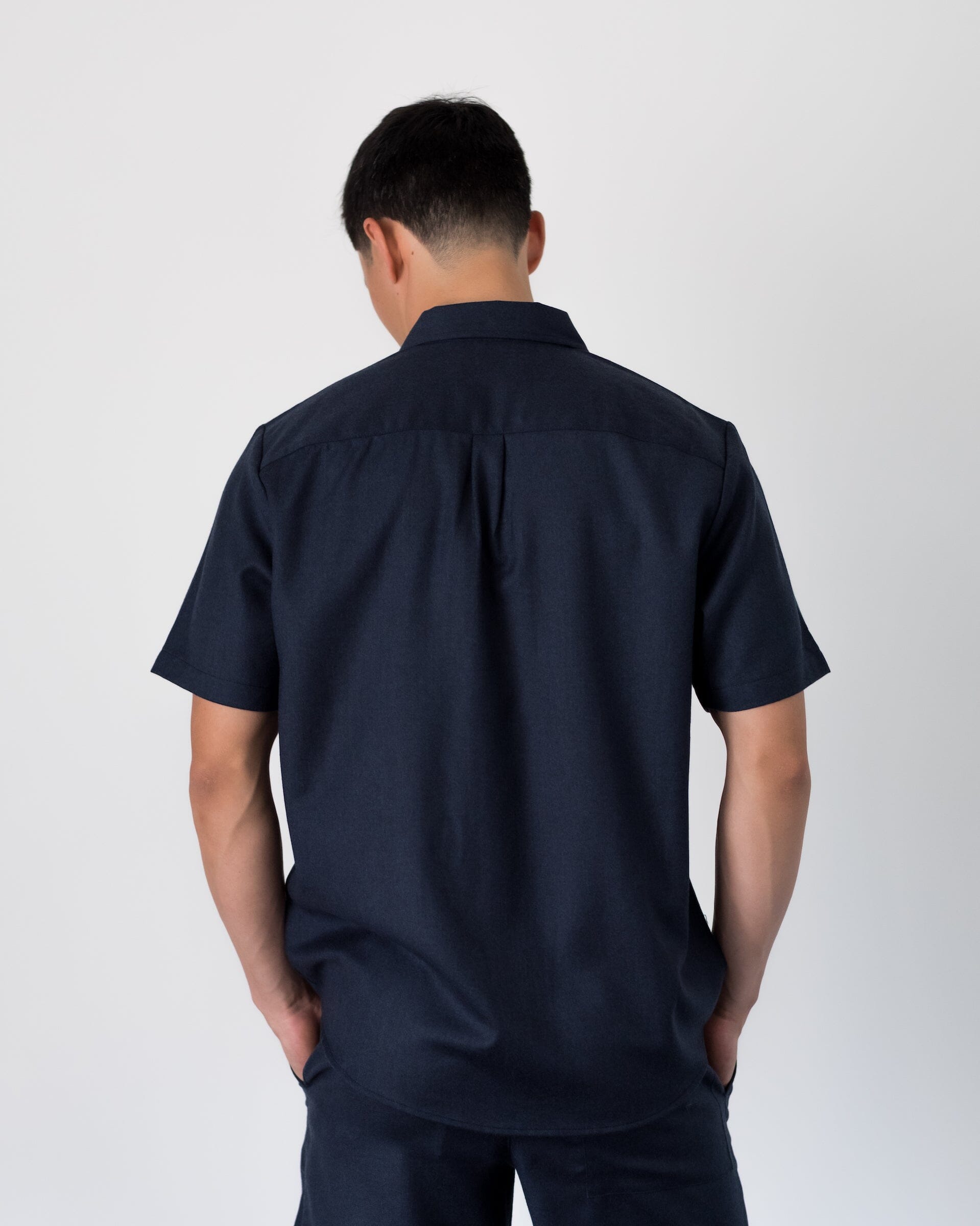 The Light Wool Short Sleeve Shirt in Heather Navy - Full Body 2 #color_heather navy