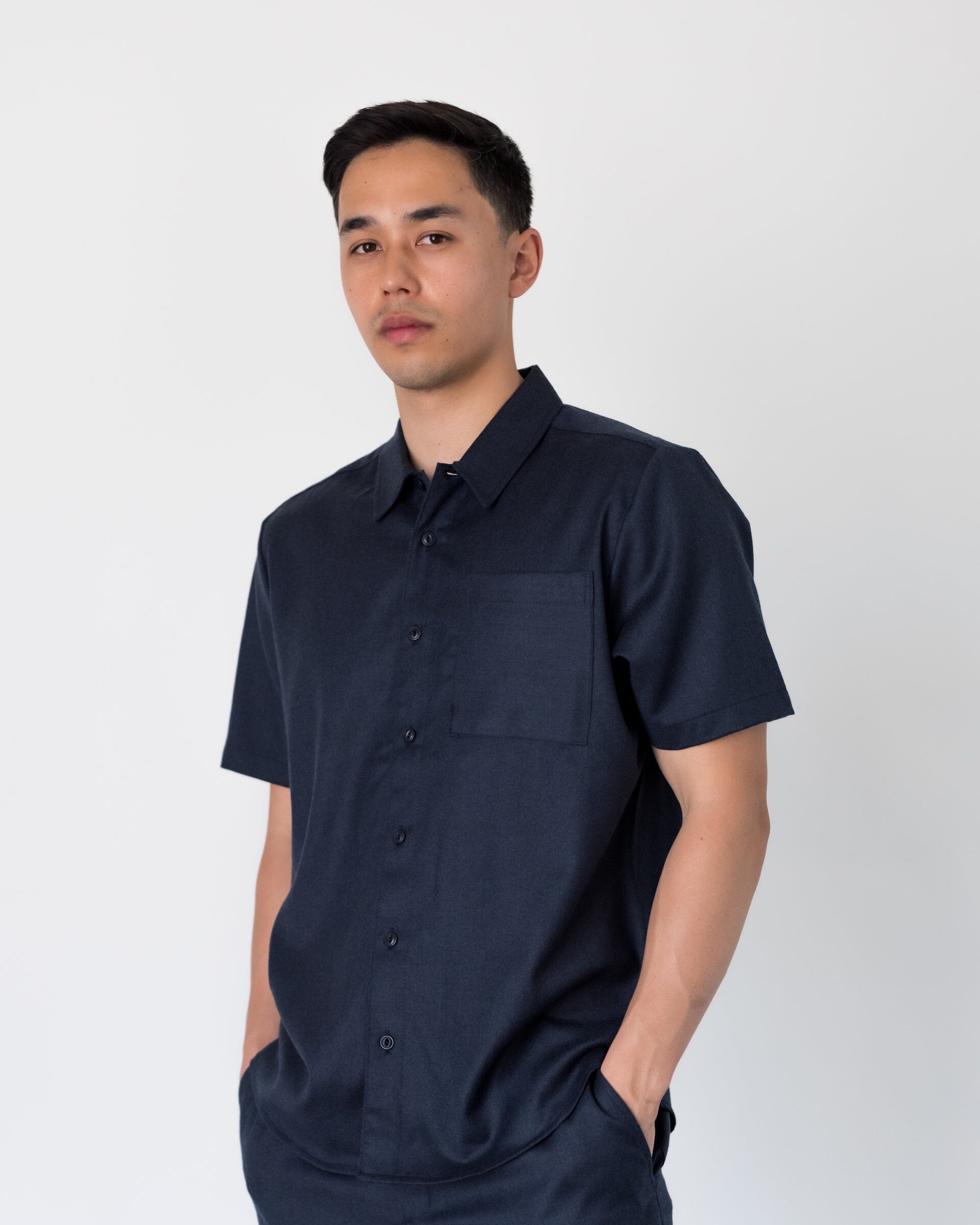 The Light Wool Short Sleeve Shirt in Heather Navy - Full Body 1 #color_heather navy